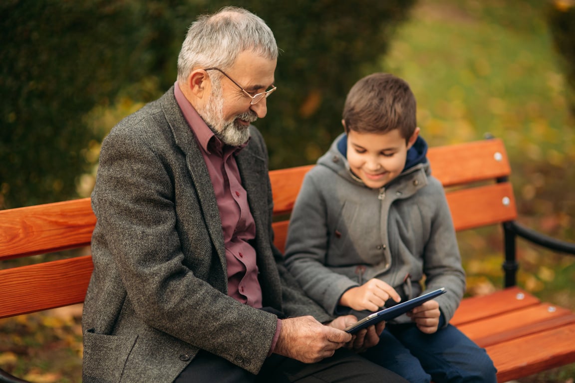 Grandpa and His Grandson Spend Time Together in the Park